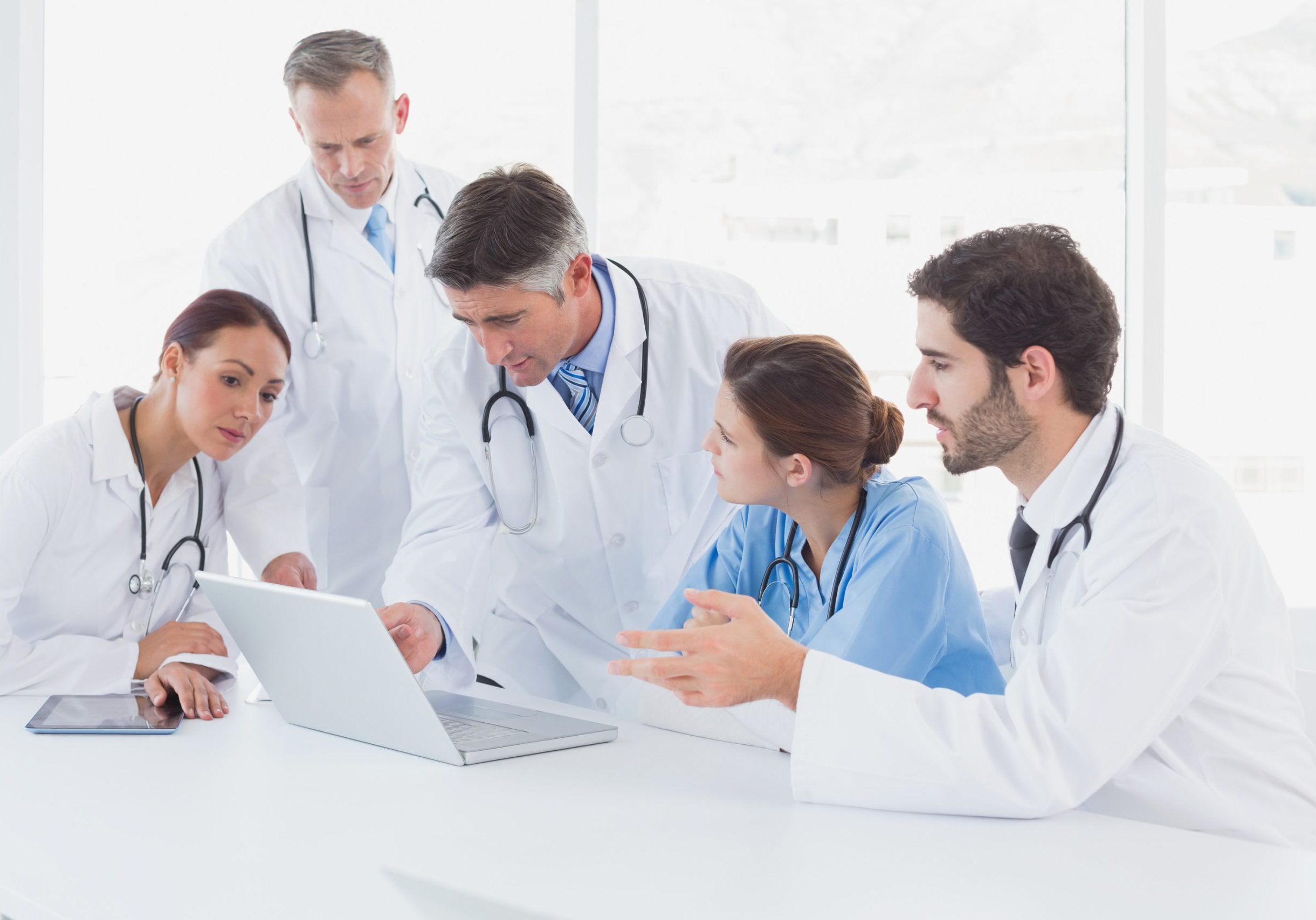 A group of doctors and nurses discussing a case