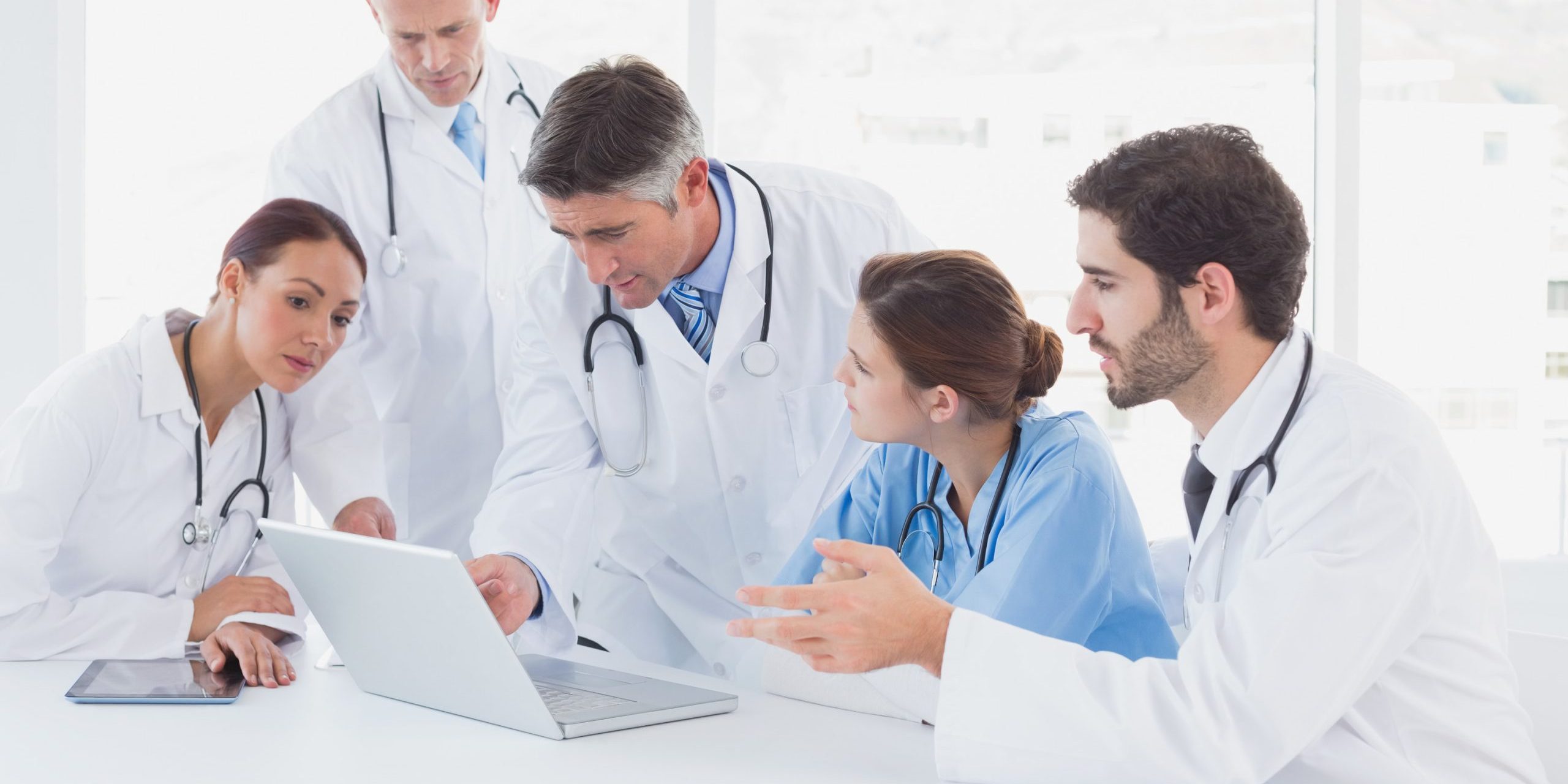 A group of doctors and nurses discussing a case
