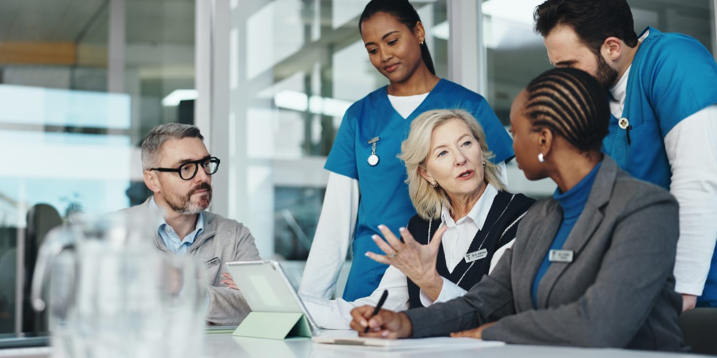 People, nurses and meeting with team in office for planning, medical report and feedback on operation. Woman, tablet and results for healthcare, surgery schedule and brainstorming of hospital funding