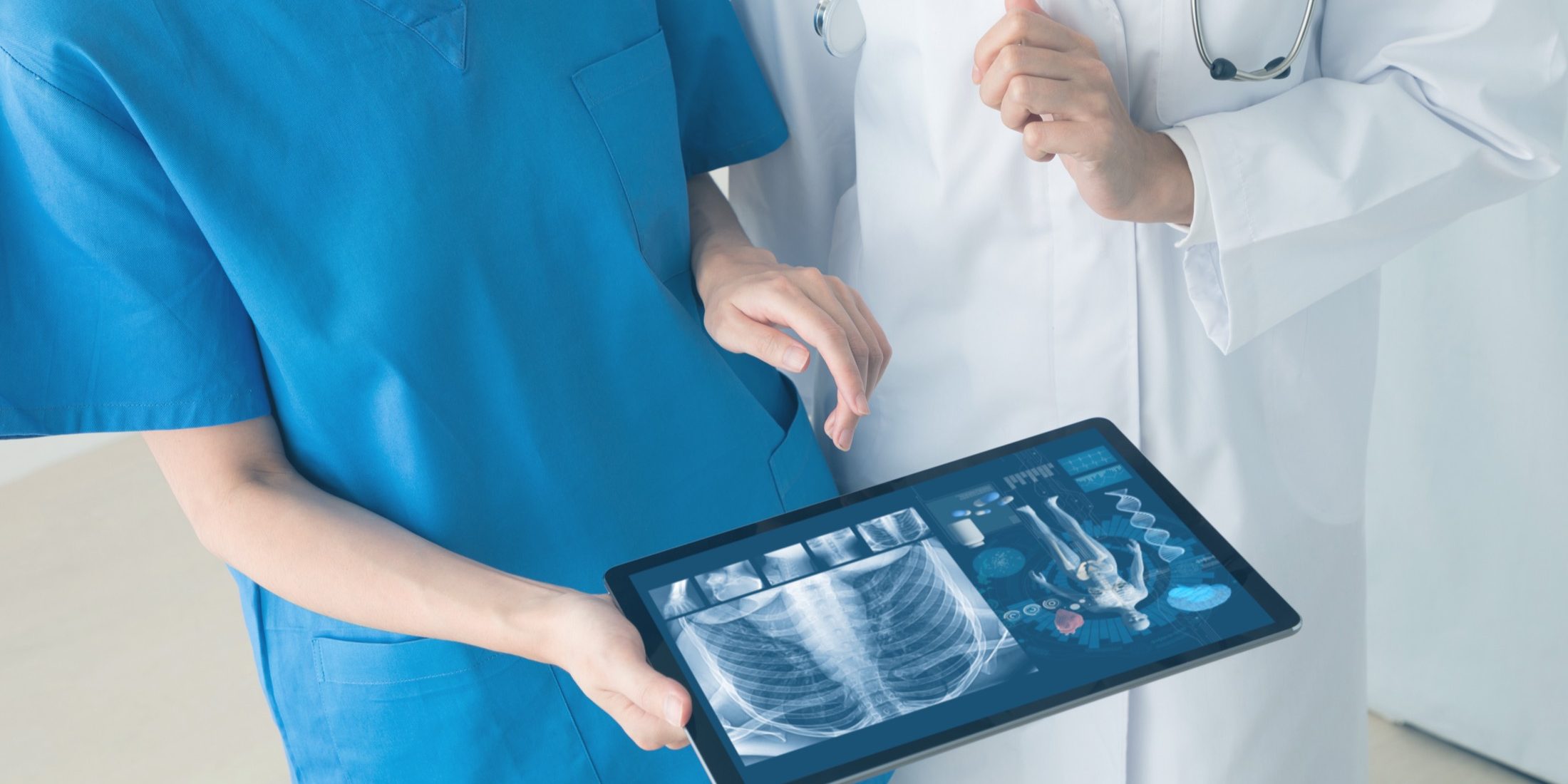 Medical technology concept. Doctor and nurse watching electronic medical record.